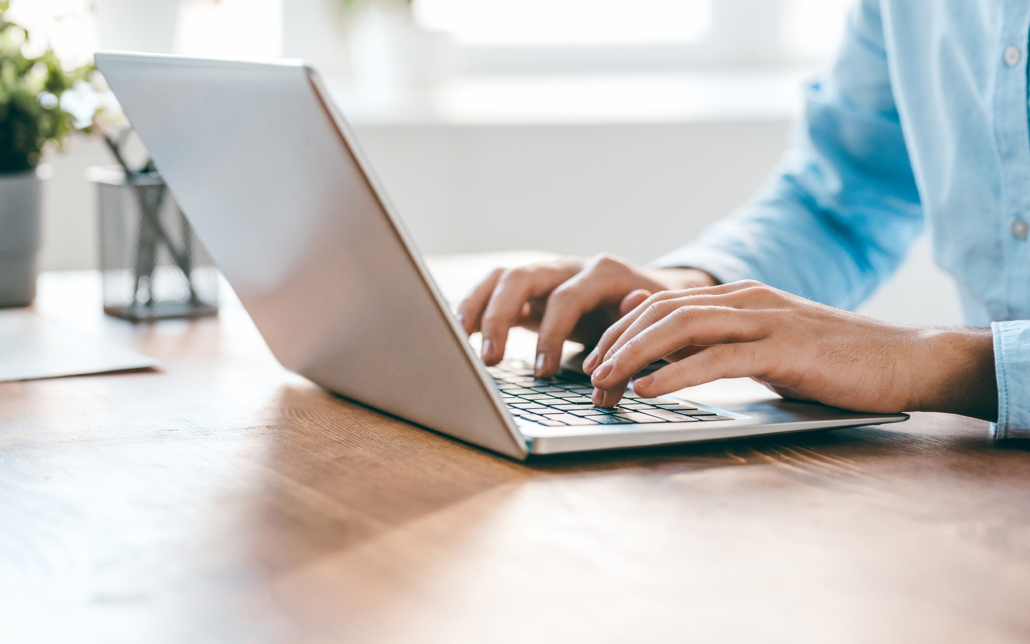 Hands Of Young Contemporary Office Manager Over Laptop Keypad During Work