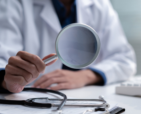 Medical Provider Fraud With Magnifying Glass